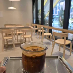 Iced coffee and window-side seating at Crack Roasters in Magok Le West