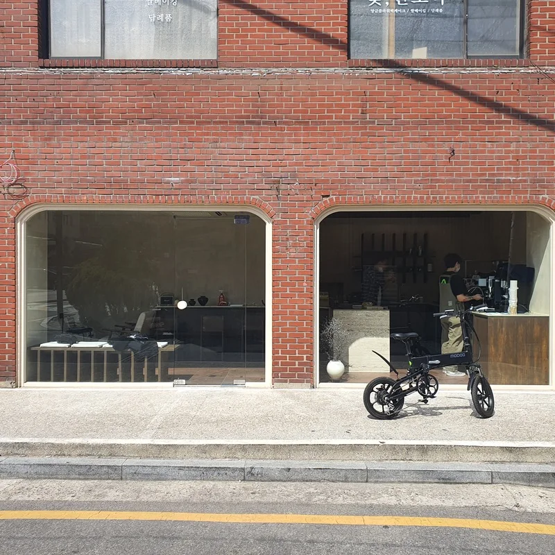 Brick façade and arched windows at Taeyang Coffee Sadang